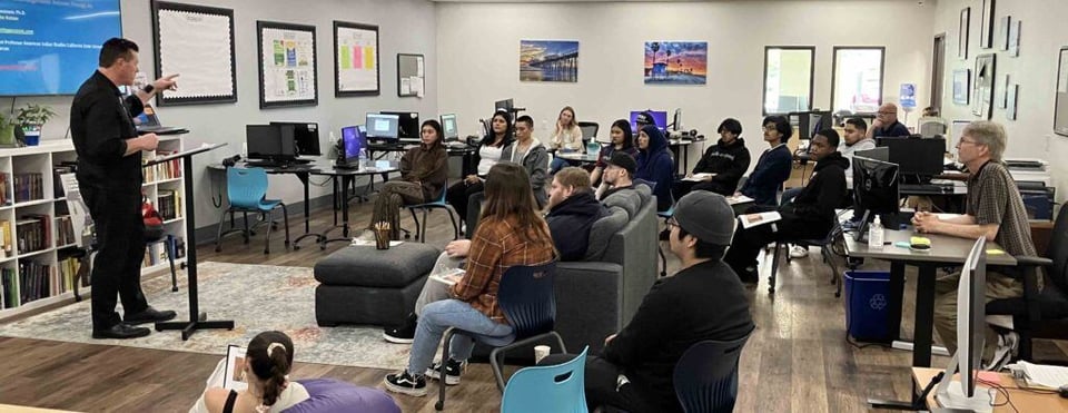 Students listen to Eric Tippeconnic during his presentation at SIATech North County High School