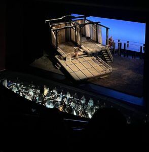 SIATech South Bay High School Students look down on stage and orchestra