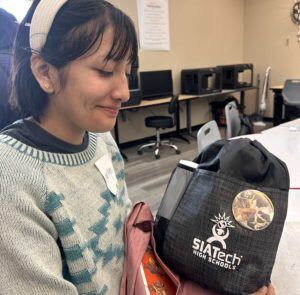 SIATech Youth Summit participants receive backpack SIATech High School