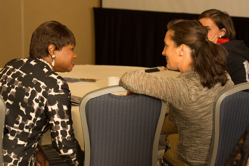 Shirley Bullard having a conversation with a collegues at the RAPSA Forum.